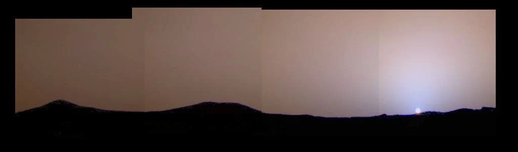 Mars Pathfinder panorama showing a blue glow near the setting Sun in a reddish Martian sky
